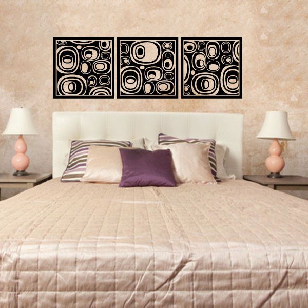 Three-panel abstract oval wall decal set with black and cream circular swirls.