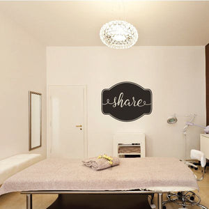 Share wall decal: black circle with white cursive 'share' lettering