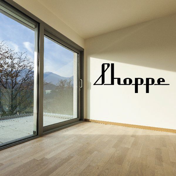 Vinyl wall decal with black Shoppe logo lettering on white wall