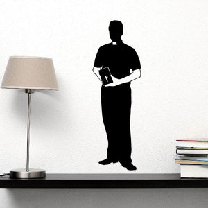 Priest decal for short sleeves: standing figure holding a book with cross