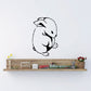Black-and-white rabbit decal with a cute crouching design