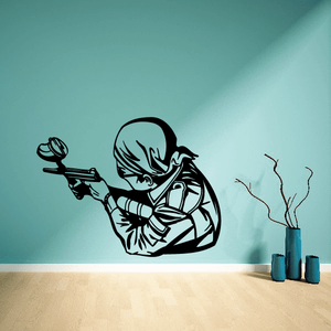 Paintball player wall decal, side-view figure holding paintball gun, black outline