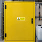 Caustic warning sticker on a chemical storage cabinet