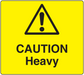 Yellow caution heavy sticker with black warning triangle and exclamation mark text