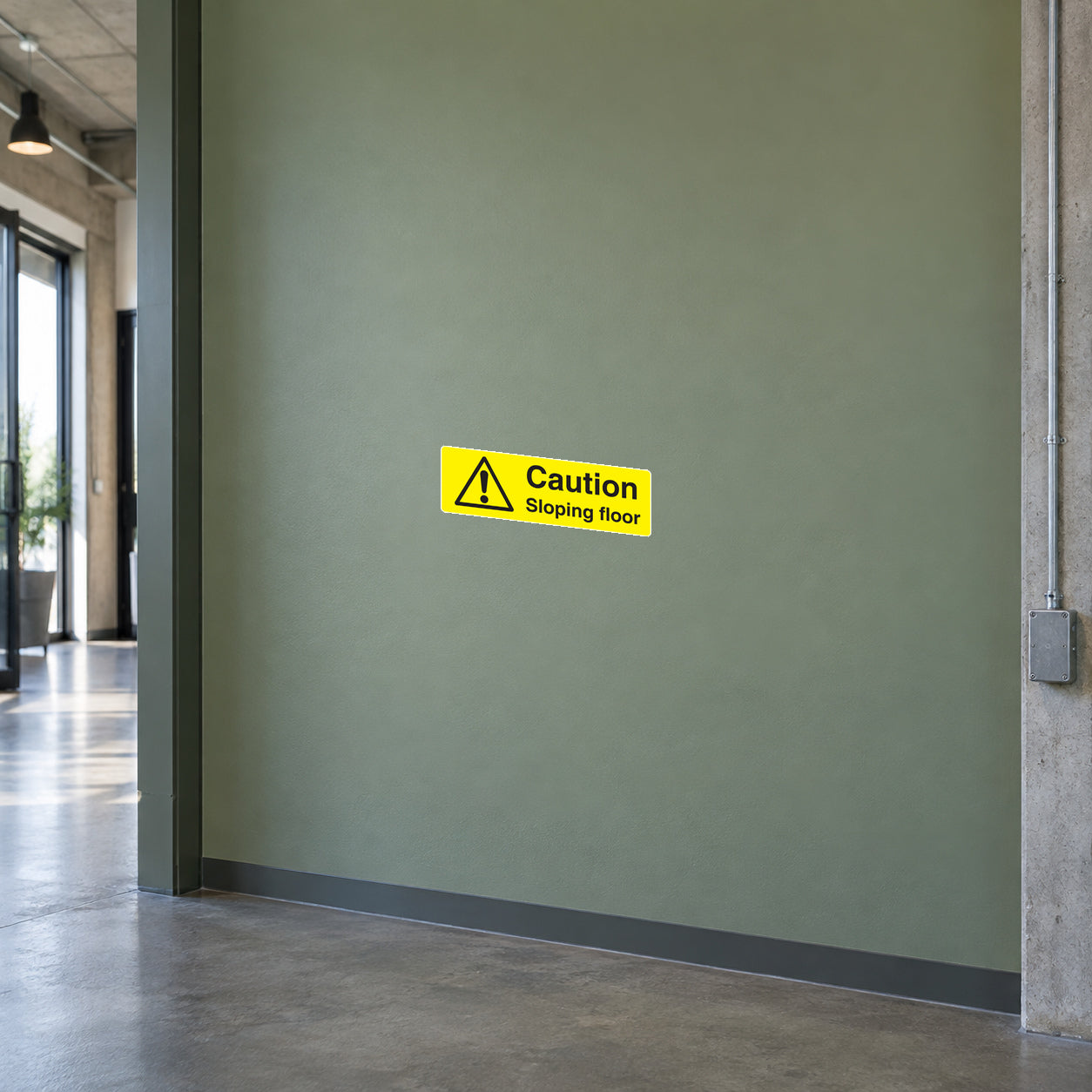 Yellow warning floor sticker with triangle icon and text Caution Sloping floor