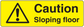 Yellow warning sticker: black triangle exclamation, 'Caution Sloping floor' text.