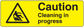 Yellow caution cleaning in progress sticker with black warning triangle and bold text