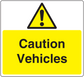 Caution Vehicles warning sticker with yellow background, black text, and hazard triangle icon