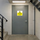 Caution To Roof Only No Exit sticker on a roof-access stairwell door