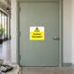 Yellow caution wet paint sign sticker with warning icon and black text