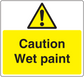 Caution wet paint warning sticker with yellow background, black text, and hazard triangle