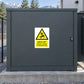 Gray metal gate with yellow warning sticker: Keep off, danger of death
