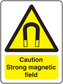 Caution strong magnetic field sticker with yellow triangle and warning text