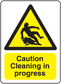 Rectangle caution cleaning in progress sticker with yellow warning sign and black text