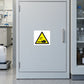 Corrosive chemical hazard warning sticker on a laboratory chemical cupboard