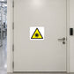 Laser warning sticker with yellow triangular hazard symbol and black sunburst icon