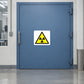 Radioactive warning sticker with yellow trefoil symbol in black-outlined triangle