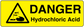 Yellow danger warning sticker with black acid hazard triangle and text 'DANGER Hydrochloric Acid'