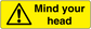 Warning mind your head sticker with yellow background, black triangle, and bold text.