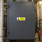 Danger Hot Surface sticker on a closed boiler service panel