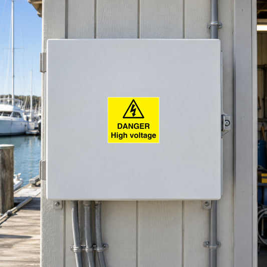 Danger high-voltage warning sticker, yellow square with black lightning icon and text
