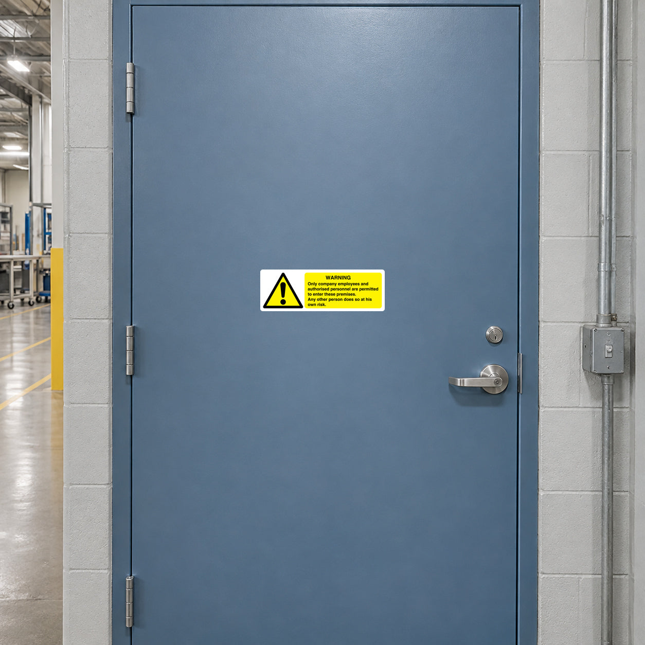 Safety warning sticker with exclamation icon and text on a door