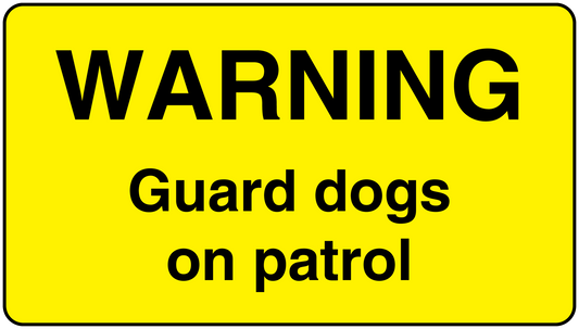 Yellow warning sticker reading 'WARNING' and 'Guard dogs on patrol'
