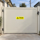 Yellow danger warning sticker on gate: overhead cables text with hazard symbol