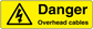 Yellow danger overhead cables warning sticker with black triangle and 'Danger Overhead cables'.