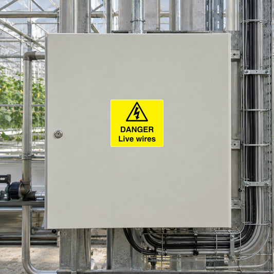 Yellow danger sticker on metal plate: DANGER Live wires warning symbol
