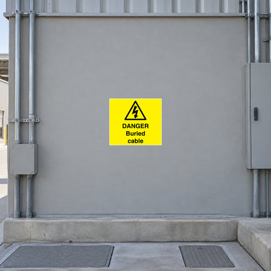 Yellow warning sticker reading "DANGER Buried cable" with black lightning symbol