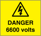 Yellow danger 6600 volts warning sticker with black lightning hazard triangle and text