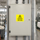 Rectangular safety warning sticker on a light gray panel, yellow label reading DANGER 440 volts