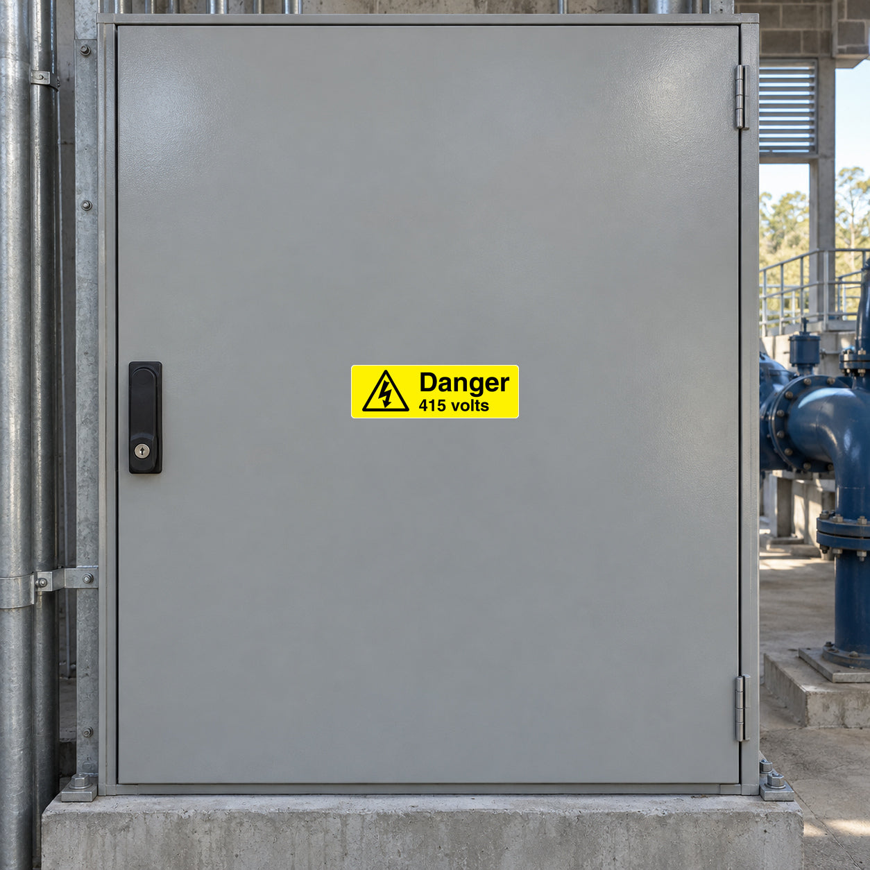 Safety warning sticker with 'Danger 415 volts' text on yellow label