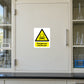 Dangerous chemicals warning sticker with hazard icon and yellow message panel