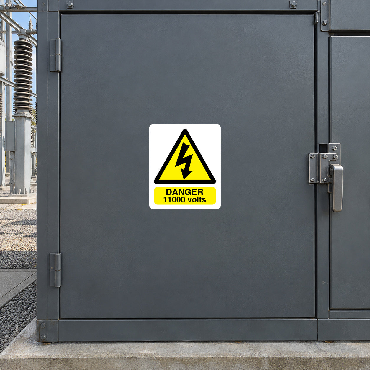 Danger 11,000 volts warning sticker with yellow triangle and bold text