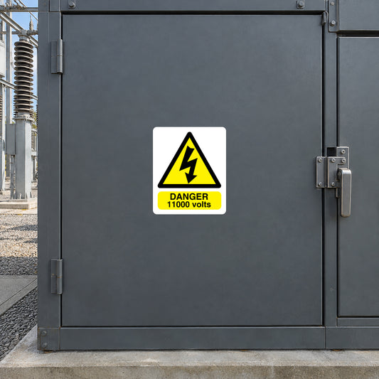 Danger 11,000 volts warning sticker with yellow triangle and bold text