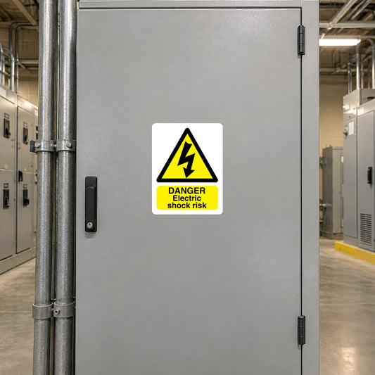 Danger Electric Shock Risk sticker on a closed industrial electrical cabinet