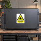 Safety warning laser beam sticker with yellow triangle and red “DANGER” label