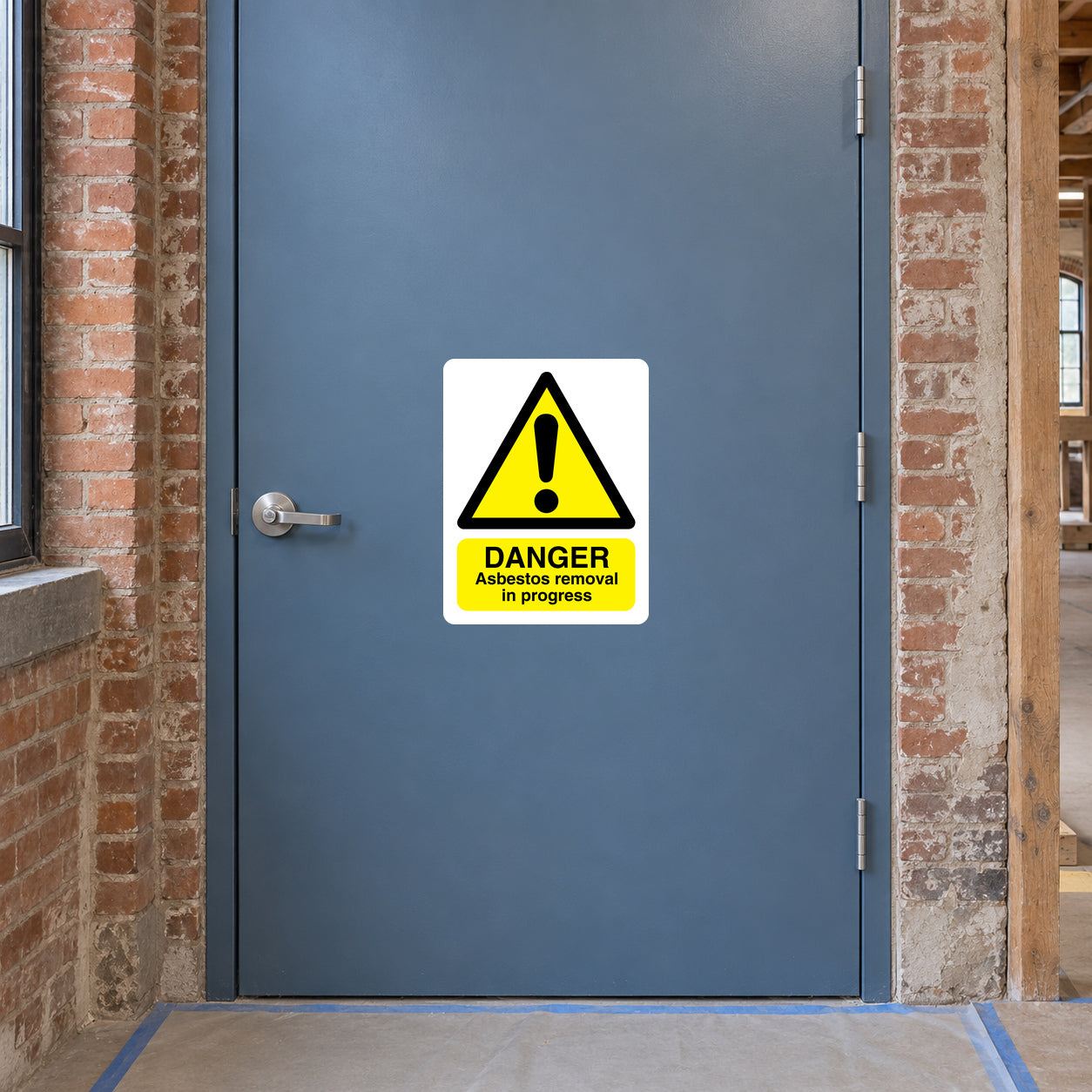 Asbestos removal danger warning sticker with yellow triangle and 'In progress' text