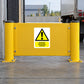 Warning sticker with yellow triangle: 'Danger reversing vehicles'