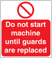 Red safety warning sticker reading "Do not start machine until guards are replaced".