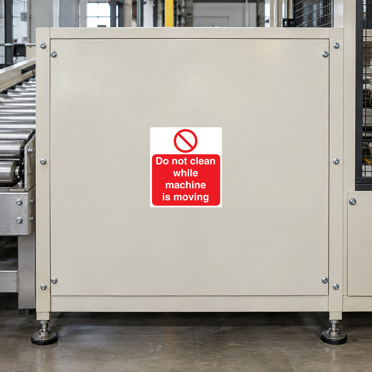 Do not clean while machine is moving warning sticker on light metal panel