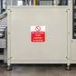 Do not clean while machine is moving warning sticker on light metal panel