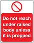 Safety sticker with red no-reach icon and text: "Do not reach under raised body unless it is propped"