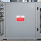 Equipment warning sticker with red no-operation symbol and small red instruction text on white label