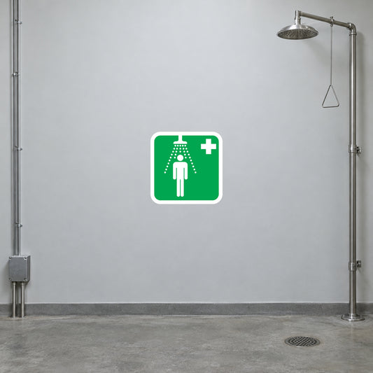 Green first aid warning sticker with white person and plus symbol icon