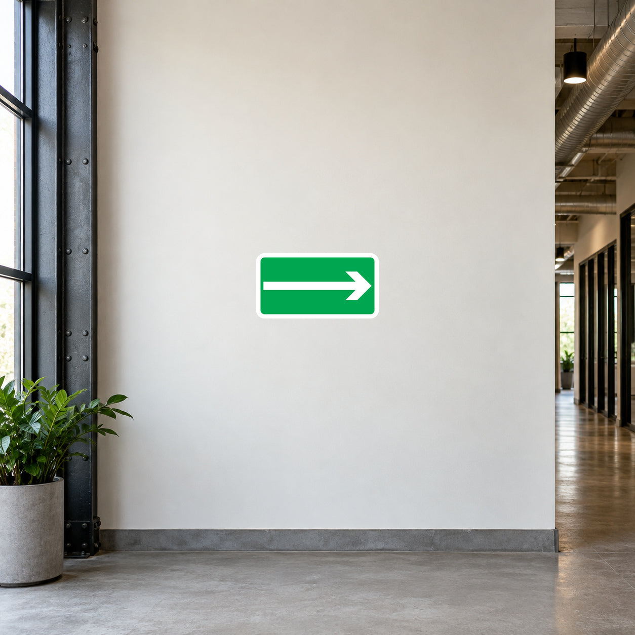 Green right-arrow direction sticker with white border and directional line