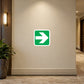 Green square sticker with white arrow pointing right