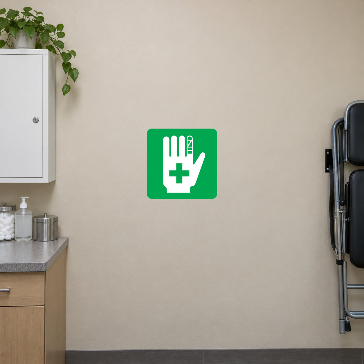 Hand first aid sticker with white hand and plus sign on green square